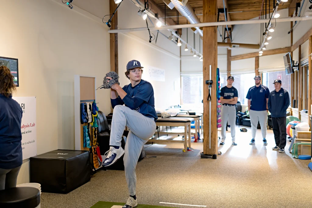 baseball player practicing his throwing form during an appointment with Complete Game Physical Therapy